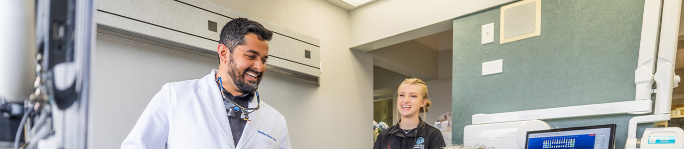 Dentist showing a patient a dental X ray