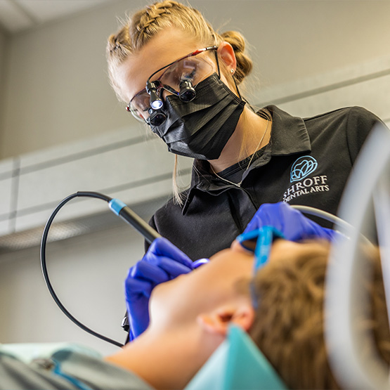 Little girl receiving a fluoride treatment