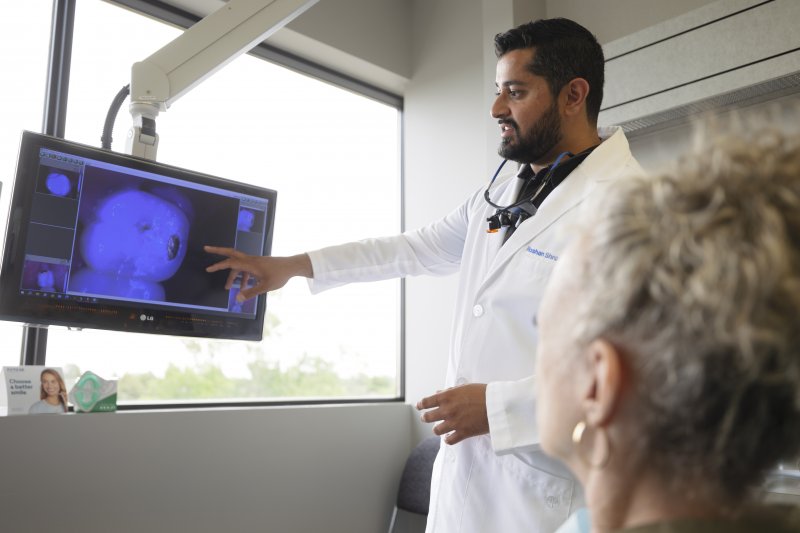 Dr. Shroff explains something to patient